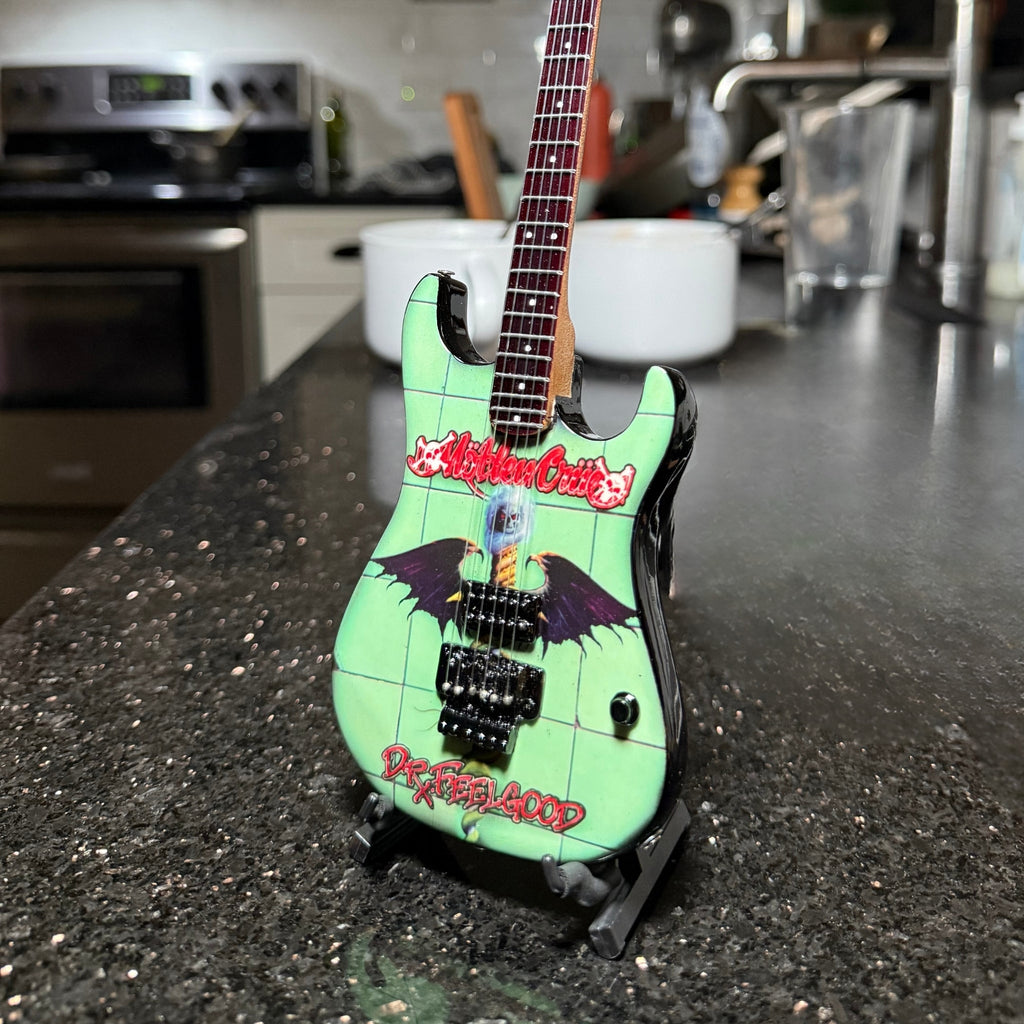 The Complete Mötley Crüe Album Cover Collectible Miniature Guitar Set – All 4 Official Mini Guitar Designs The Mini Axe