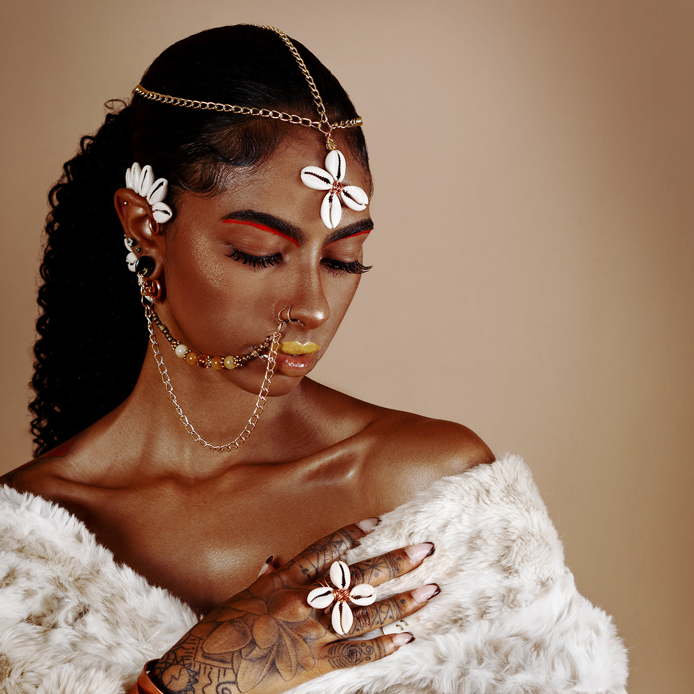 Cowrie Star Ear Cuff Adorned In Taji