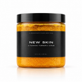NEW SKIN, A FOAMING TURMERIC SCRUB Predominantly Black