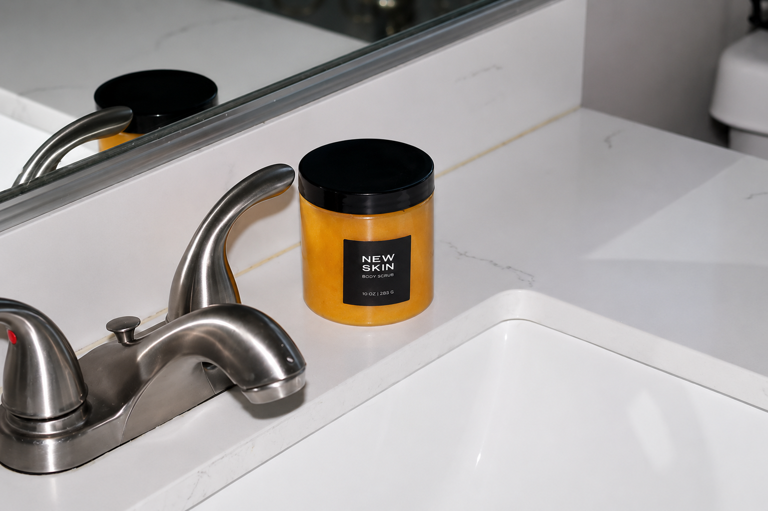 NEW SKIN, A FOAMING TURMERIC SCRUB Predominantly Black