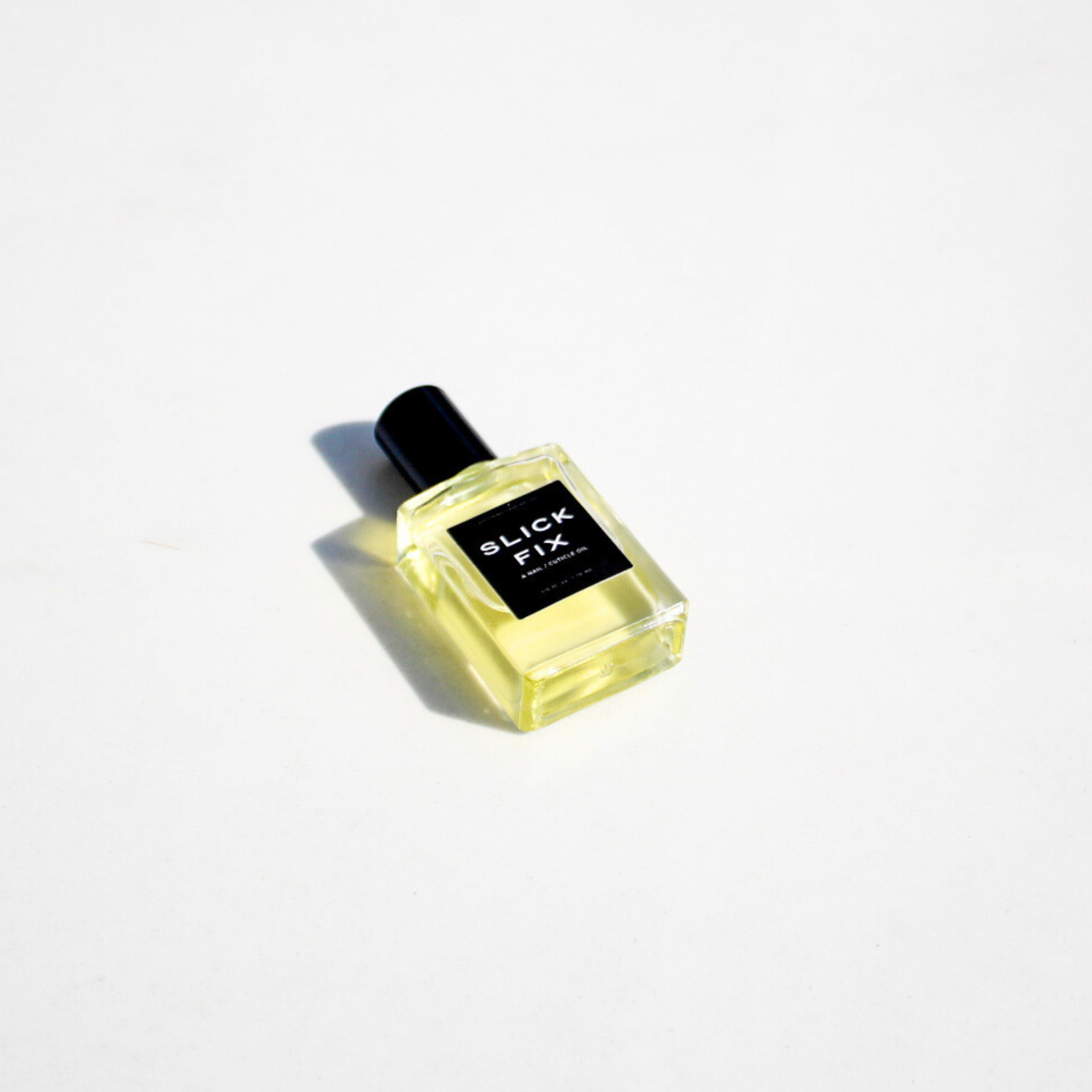SLICK FIX, A NAIL / CUTICLE OIL Predominantly Black