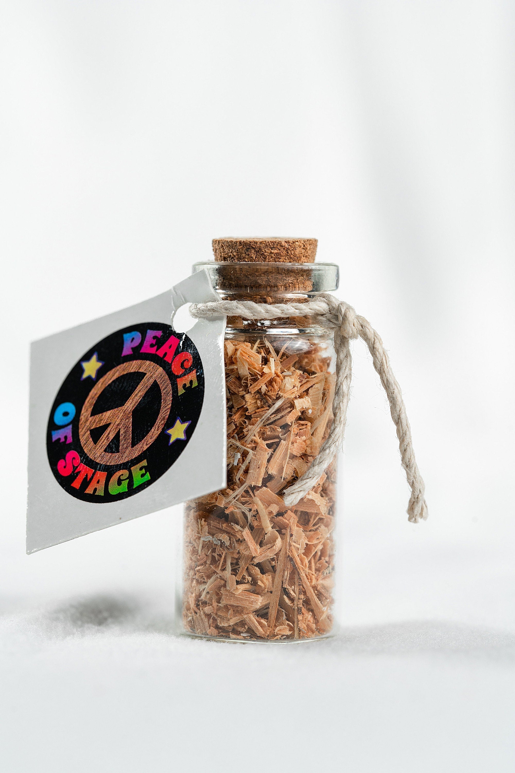 Glass Bottle Filled with Shavings and Sawdust from the Original 1969 Woodstock Stage Wood Peace Of Stage LLC