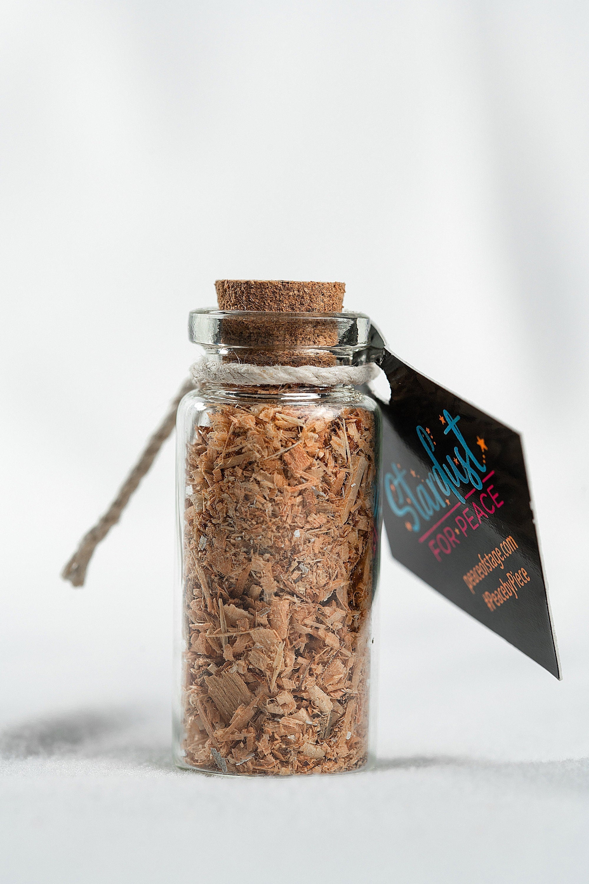 Glass Bottle Filled with Shavings and Sawdust from the Original 1969 Woodstock Stage Wood Peace Of Stage LLC