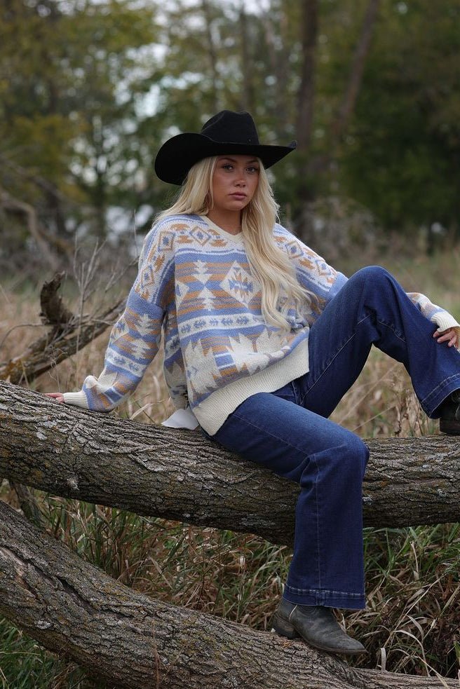 Main Strip Southwestern Knit Sweater — Oversized V-Neck with Bold Blue, Tan & Cream Print Cowhide and Conchos