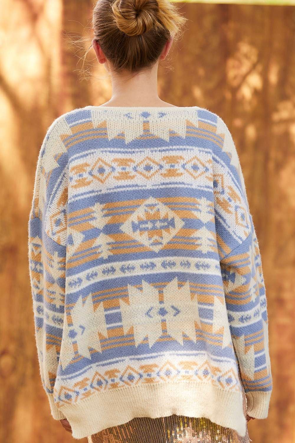 Main Strip Southwestern Knit Sweater — Oversized V-Neck with Bold Blue, Tan & Cream Print Cowhide and Conchos