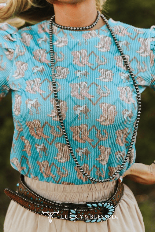 LUCKY & BLESSED Turquoise Boots Print Puff Short Sleeve Western Top — Iconic Western Boot Print Cowgirl Statement Cowhide and Conchos